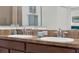 Bathroom double vanity with two white ceramic sinks and chrome fixtures at 15613 Camp Dubois Cres, Winter Garden, FL 34787