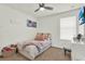 Cozy bedroom with a comfortable bed, decorative pillows, and a ceiling fan at 15613 Camp Dubois Cres, Winter Garden, FL 34787
