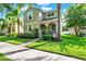 Inviting two-story home with a well-manicured lawn and a cozy front porch at 15613 Camp Dubois Cres, Winter Garden, FL 34787
