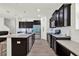 Spacious kitchen featuring a center island, granite countertops, and modern stainless steel appliances at 15613 Camp Dubois Cres, Winter Garden, FL 34787
