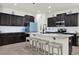 Gourmet kitchen with granite countertops, stainless steel appliances, and a large center island at 15613 Camp Dubois Cres, Winter Garden, FL 34787