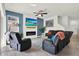Cozy living room features stylish decor, modern fireplace, and plenty of seating at 15613 Camp Dubois Cres, Winter Garden, FL 34787