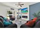 Inviting living room with a fireplace, comfortable seating, and lots of natural light at 15613 Camp Dubois Cres, Winter Garden, FL 34787