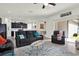 Open-concept living room with modern furnishings and sliding door access to the outdoor patio at 15613 Camp Dubois Cres, Winter Garden, FL 34787