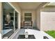 Covered patio with seating area and natural light, perfect for relaxation at 15613 Camp Dubois Cres, Winter Garden, FL 34787