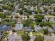 Wide aerial view of the neighborhood showcasing lush landscaping and residential homes at 1921 Geronimo Trl, Maitland, FL 32751