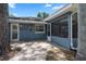 Paver patio leads to an enclosed porch in the backyard at 1921 Geronimo Trl, Maitland, FL 32751