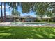 Beautiful backyard with pool, patio, and lush green lawn perfect for outdoor enjoyment at 1921 Geronimo Trl, Maitland, FL 32751