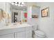 Bright bathroom with white vanity, mirror, and modern fixtures at 1921 Geronimo Trl, Maitland, FL 32751
