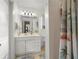 Bright bathroom featuring a shower, tiled floors, and a vanity with ample storage at 1921 Geronimo Trl, Maitland, FL 32751