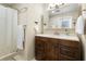 Traditional bathroom with white countertop, dark wood vanity, and shower with decorative curtain at 1921 Geronimo Trl, Maitland, FL 32751