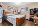 Cozy bedroom with sports memorabilia, hardwood floors, and a comfortable queen bed at 1921 Geronimo Trl, Maitland, FL 32751