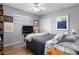 Bright bedroom with a large window, hardwood floors, and comfortable furniture at 1921 Geronimo Trl, Maitland, FL 32751