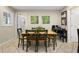 Inviting dining area featuring a wood table with green accents and tile flooring for easy maintenance at 1921 Geronimo Trl, Maitland, FL 32751