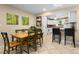 Relaxed dining area with breakfast bar looking into the kitchen area, creating an inclusive living space at 1921 Geronimo Trl, Maitland, FL 32751
