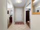 Inviting foyer with tiled floors, a white front door, and views of the interior at 1921 Geronimo Trl, Maitland, FL 32751