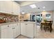 Spacious kitchen and dining area showcasing seamless indoor-outdoor flow at 1921 Geronimo Trl, Maitland, FL 32751
