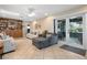 Cozy Gathering room with built-in shelving, comfortable seating, and access to the outdoors at 1921 Geronimo Trl, Maitland, FL 32751