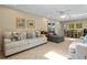 Spacious living area with comfortable seating, a dining area, and access to the backyard at 1921 Geronimo Trl, Maitland, FL 32751