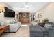Bright and airy living room with tile floors, a ceiling fan, and comfortable seating at 1921 Geronimo Trl, Maitland, FL 32751