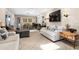 Open-concept living room with a dining area, comfortable seating, and plenty of natural light at 1921 Geronimo Trl, Maitland, FL 32751
