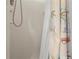 Brightly lit shower features tile and a shower curtain at 1921 Geronimo Trl, Maitland, FL 32751