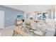 Modern dining and living area with an open floor plan and plenty of natural light at 2349 Southbury Dr, Kissimmee, FL 34744