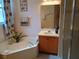Bright bathroom features a soaking tub, shower, vanity, and decorative accents at 2474 Cimmaron Ash Way, Apopka, FL 32703