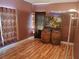 Unfurnished bedroom with hardwood floors, decorative wine barrels, and unique decor at 2474 Cimmaron Ash Way, Apopka, FL 32703