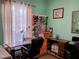 This office features a sewing machine, pegboard thread rack, and a desk for a creative workspace at 2474 Cimmaron Ash Way, Apopka, FL 32703