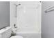 Clean white tiled bathtub and toilet combo in the bathroom at 2520 Caper Ln # 206, Maitland, FL 32751