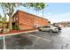 Apartment building with parking lot, featuring lush landscaping and a brick facade at 2520 Caper Ln # 206, Maitland, FL 32751