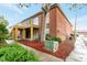Brick apartment building with a balcony and a landscaped ground and large tree at 2520 Caper Ln # 206, Maitland, FL 32751