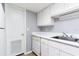 Kitchen equipped with white appliances, ample cabinet space, and tile flooring at 2520 Caper Ln # 206, Maitland, FL 32751