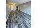 An inviting living room featuring gray walls, ceiling fan, and stylish laminate flooring at 2520 Caper Ln # 206, Maitland, FL 32751