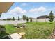 The fenced backyard includes a seating area around a fire pit and a swing set at 267 Williamson Dr, Davenport, FL 33897