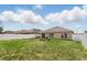 The home has a well-maintained backyard, white fence, and an outdoor seating area at 267 Williamson Dr, Davenport, FL 33897