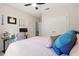 Bedroom featuring a pink bed, computer desk, a ceiling fan, and closet space at 267 Williamson Dr, Davenport, FL 33897