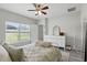 Bright bedroom featuring a ceiling fan, view of the backyard, and natural light at 267 Williamson Dr, Davenport, FL 33897