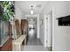 Bright entryway featuring neutral walls, a console table, and views of the living area at 267 Williamson Dr, Davenport, FL 33897