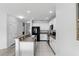 Spacious kitchen featuring white cabinets, granite countertops, and stainless steel appliances at 267 Williamson Dr, Davenport, FL 33897