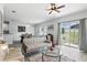Inviting living area with a ceiling fan, natural light, and an open layout to the dining area at 267 Williamson Dr, Davenport, FL 33897
