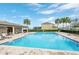The community pool area offers a refreshing escape with ample seating and shade at 267 Williamson Dr, Davenport, FL 33897