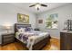 Cozy bedroom with wood floors, a ceiling fan, and a window, providing a relaxing retreat at 2696 Clearview St, Clermont, FL 34711