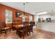 Open dining area with a wooden table and chairs, connecting seamlessly to the adjacent kitchen and living spaces at 2696 Clearview St, Clermont, FL 34711