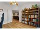 This office features hardwood floors and a built-in bookshelf, offering ample storage and a touch of elegance at 2696 Clearview St, Clermont, FL 34711