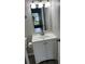 Updated bathroom vanity with a mirror, modern faucet, and ample storage at 2776 Curry Ford Rd # Ge, Orlando, FL 32806
