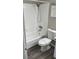 Bathroom featuring a tub/shower combo and white fixtures at 2776 Curry Ford Rd # Ge, Orlando, FL 32806