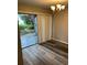 Dining room with sliding doors that open to a lush landscaped outdoor area at 2776 Curry Ford Rd # Ge, Orlando, FL 32806