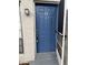 Inviting blue front door with a screen door, a unit number, and outdoor lighting at 2776 Curry Ford Rd # Ge, Orlando, FL 32806